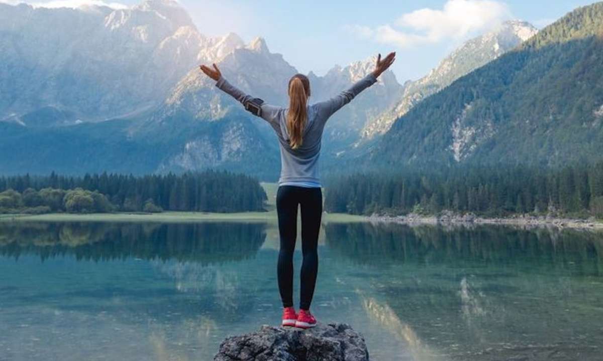 Relaxed Woman breathing freshed air in a beautiful place.