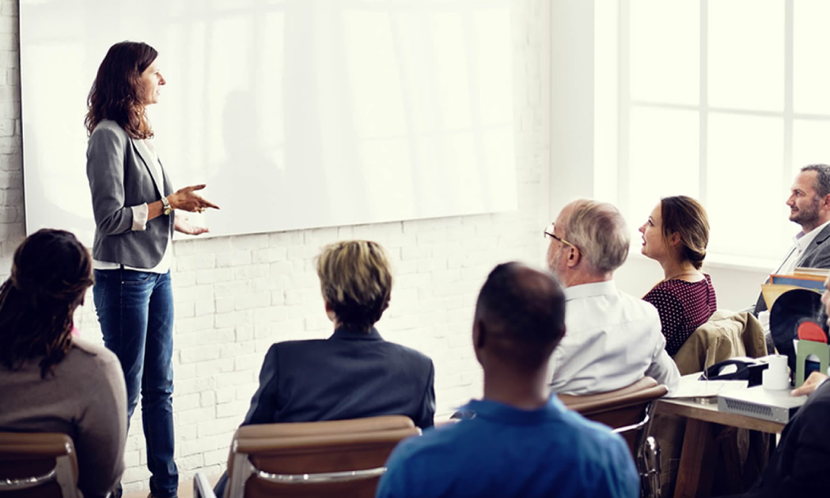 Image Showing A Business Training Concept - Young Girl Explaining her concept to her leads.